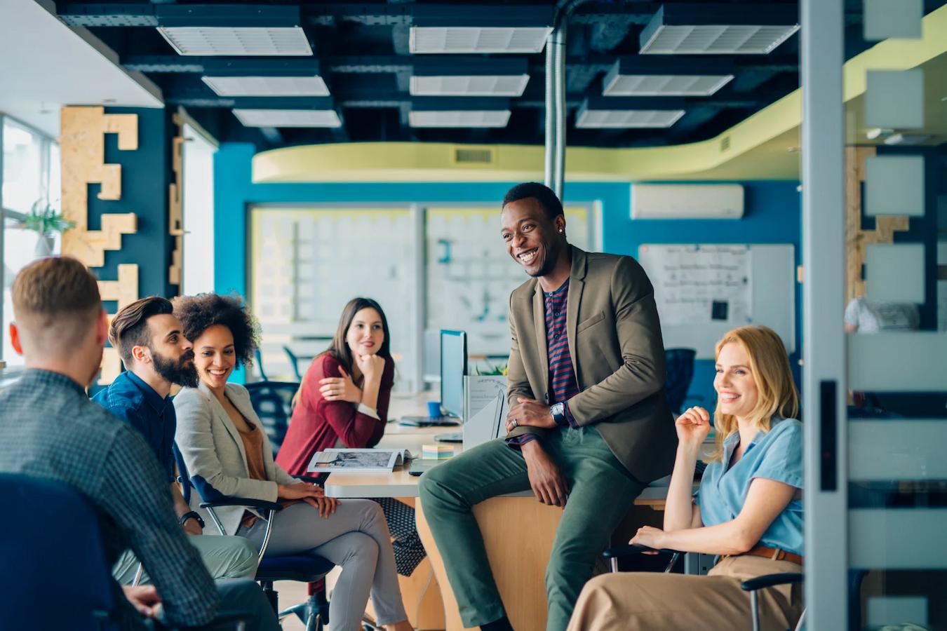 a group of people laughing together desire amenities entice people thought leadership deliver flexible amenities create connection expectations workday sense food work day strategy room hotel industry