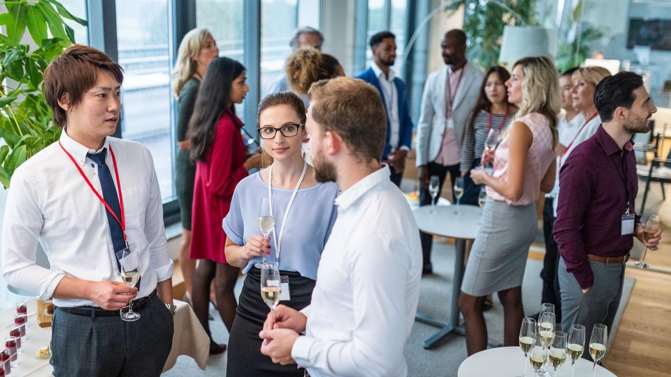 a group of people talking at a conferences spend time benefit network sports businesses entertainment companies perfect event valued clients concerts participate stakeholders attendees concerts excitement food benefits guests corporate hospitality