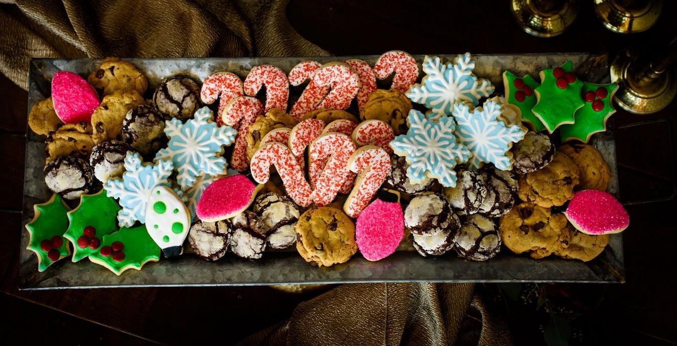 a large plate of holiday cookies office christmas party ideas gift tags fitness or wellness activity themed party ugly sweater party movie night photo booth