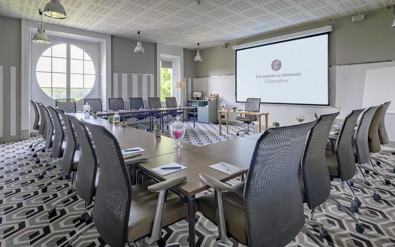 a meeting space venue with tables and chairs fire exits amenities atmosphere budget services range stage create successful business