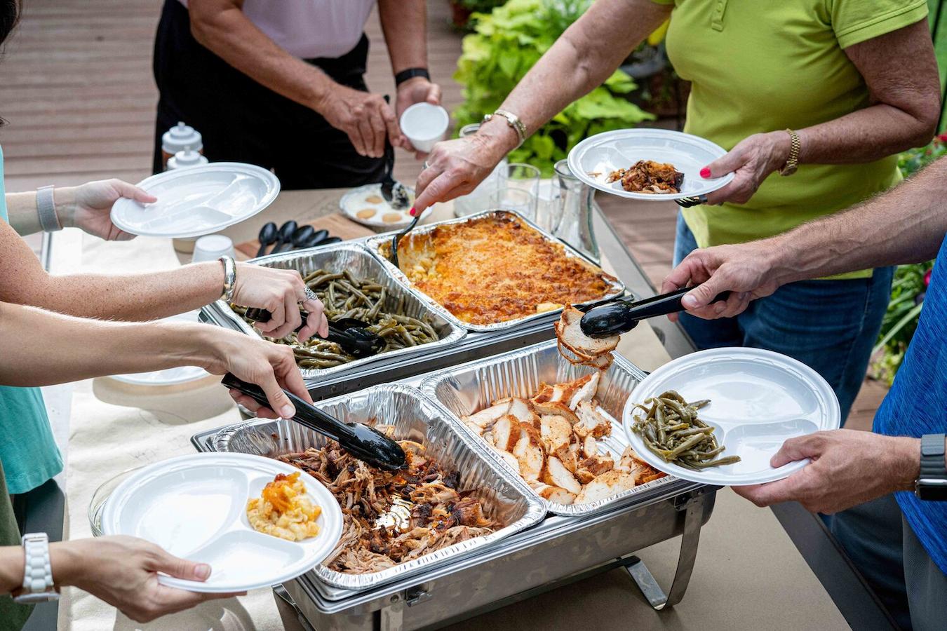a table full of barbeque food being served outside party treat contributions party celebrated extra time left unchanged summer engaging activity labor day activity party rest organization office volunteer event honor workers hours early labor day weekend employees