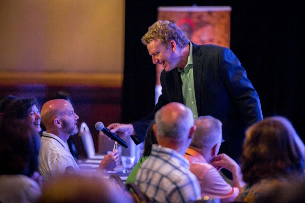 adam christing emcee crowd at a corporate event