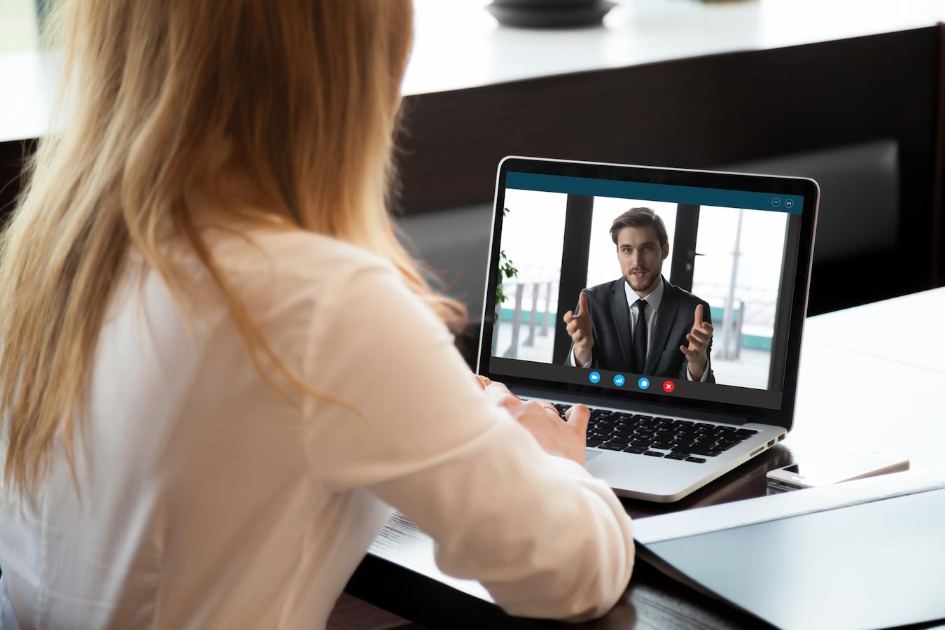 Colleagues talk on video chat about how to secure event sponsorship in a timely manner