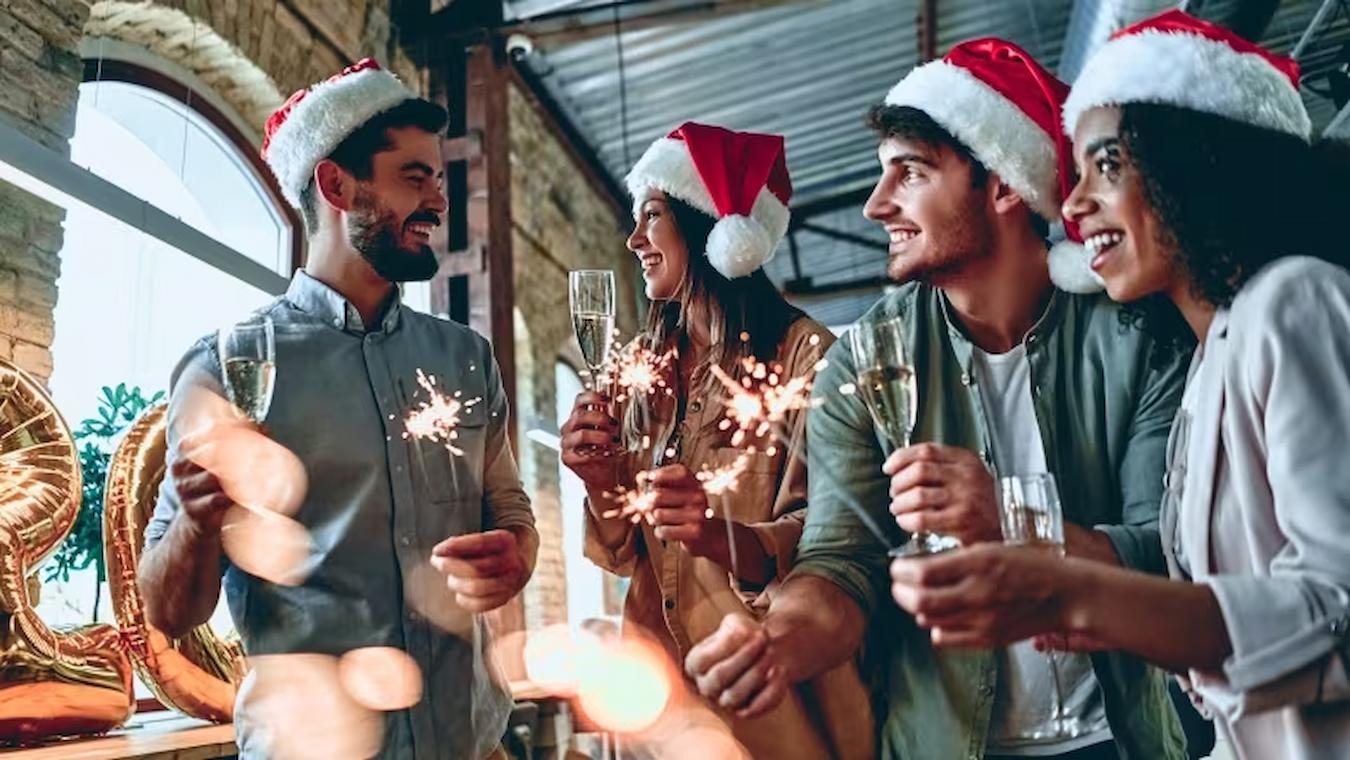 employees with santa hats and drinks require participation year's resolutions religious holidays religious identity personality images meal sharing create celebrate company's offer floating holidays inclusive holidays holidays