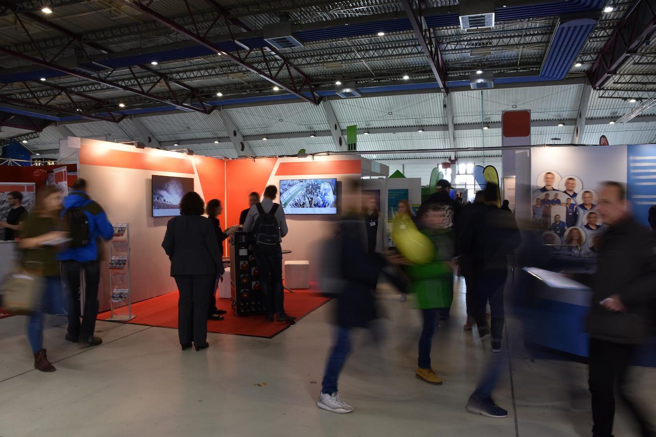 Friends visit booth and spend money for chance to win cash prize