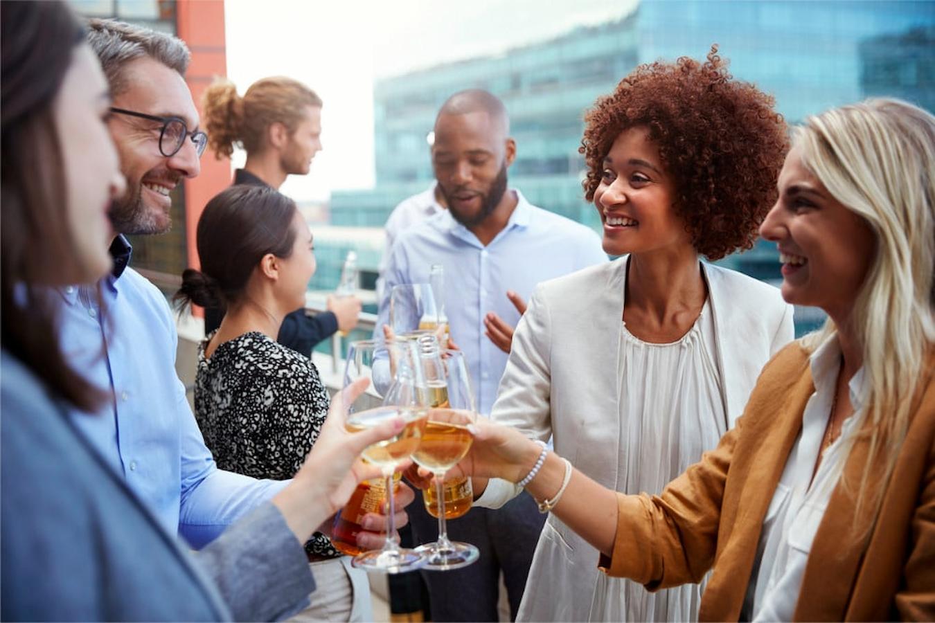 group of professionals smiling and clinking glasses daunting task potential leads new customers lead establish network host money showcase charity market attend success establish services events benefit