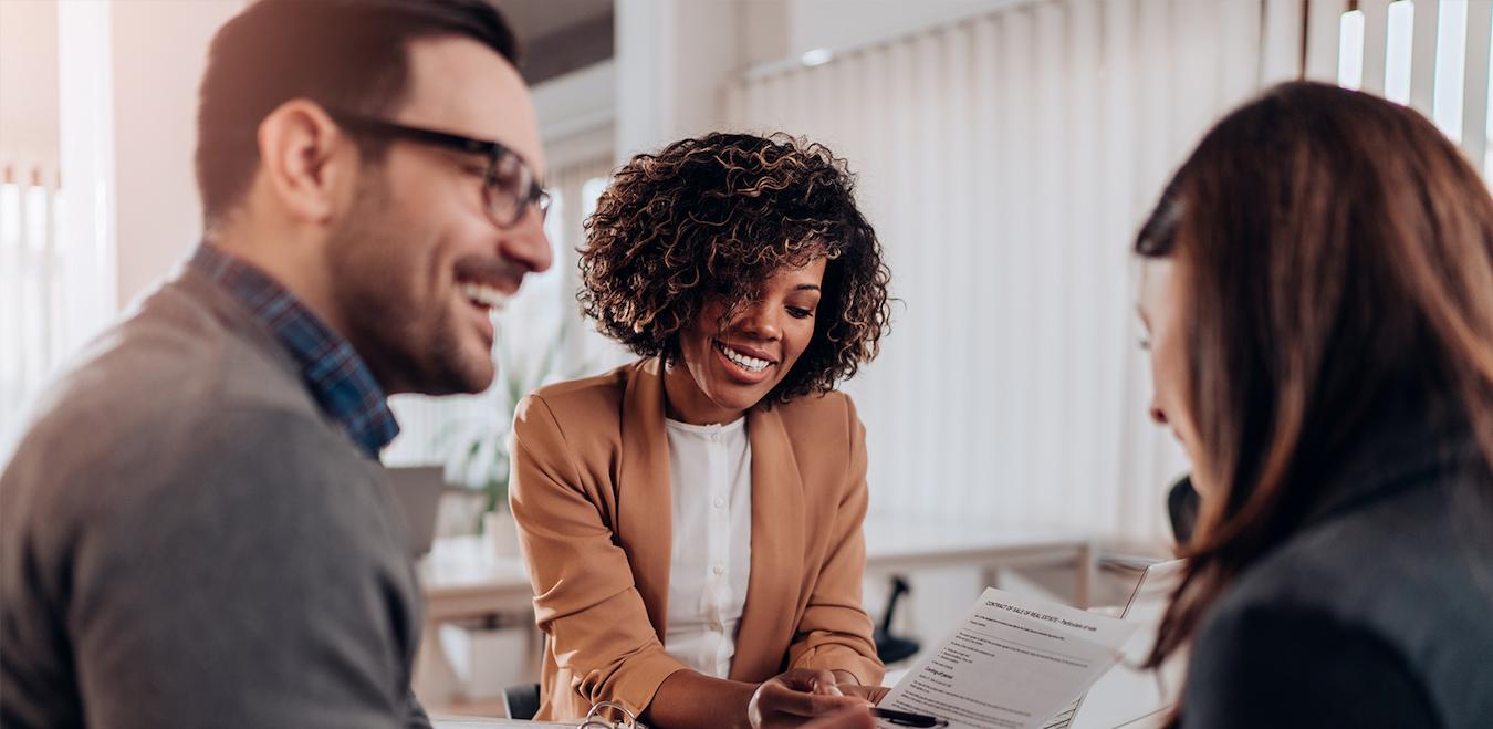 group of workers smiling and talking looking at a document success forward school aim eating skills benefit course
