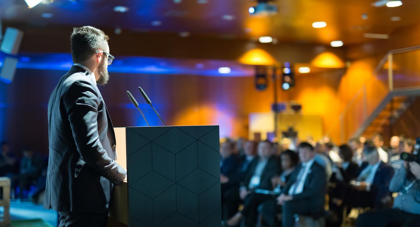 Keynote at business meeting describes process of leading entertainment expert and common reasons to entertain with marketing