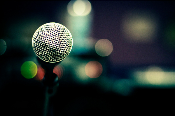 photo of microphone in front of a crowd before keynote