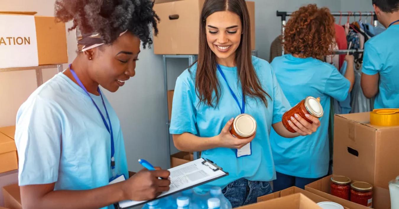 people gathering food for a food drive holiday season approaches healthy competition distributed teams senior citizens hand turkey mashed potatoes cooking skills
