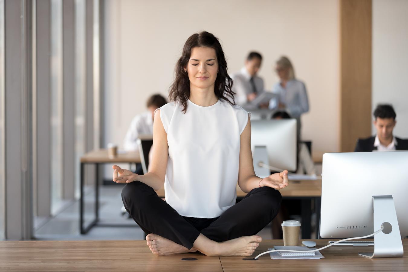 Person improves work life balance by meditating after a meeting
