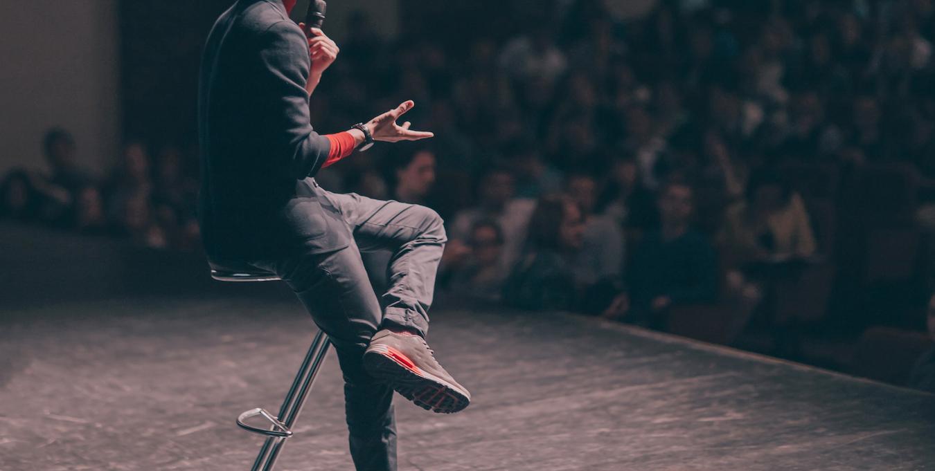 Photo of a man speaking to audience