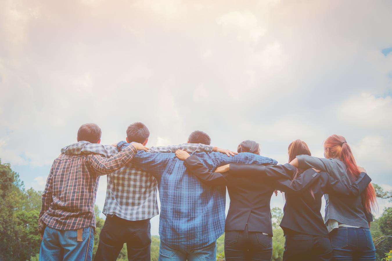 Six colleagues look at beautiful outdoor view