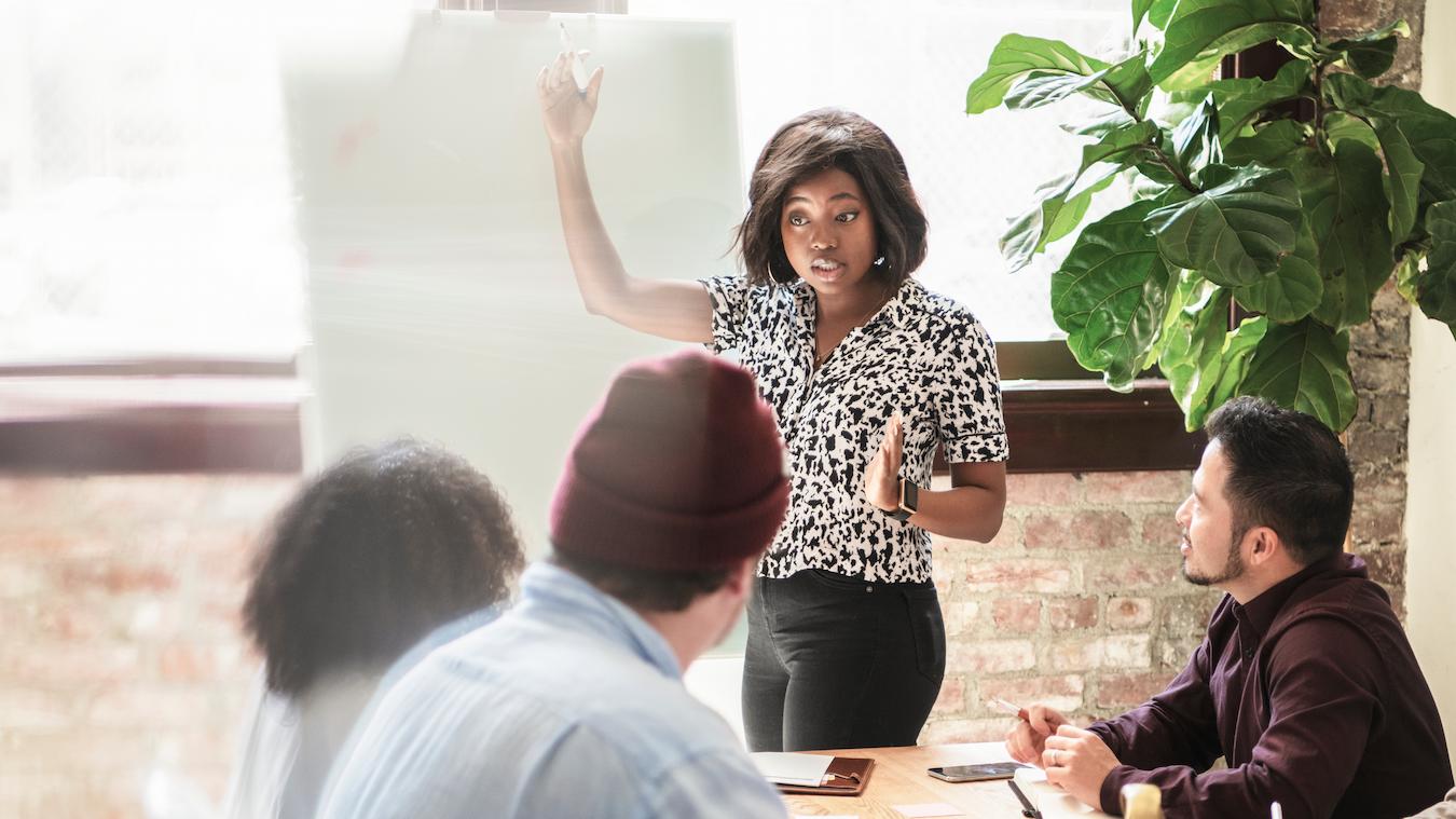 Thought leader gives valuable insights in composed manner during business meeting