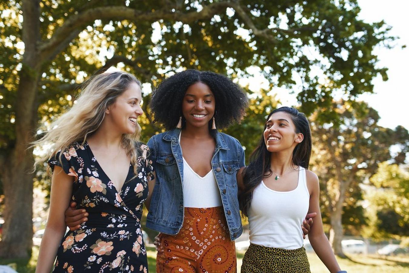 three girls waling together outside by trees recognition programs employee retention hard work life balance shortened workday traditional way public recognition programs workers rights picnic recognize contributions organization ideas summer ideas office ideas employees
