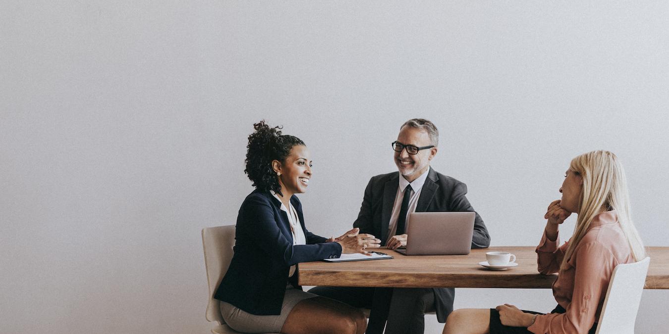 Three people work on organizing important things for a complete process