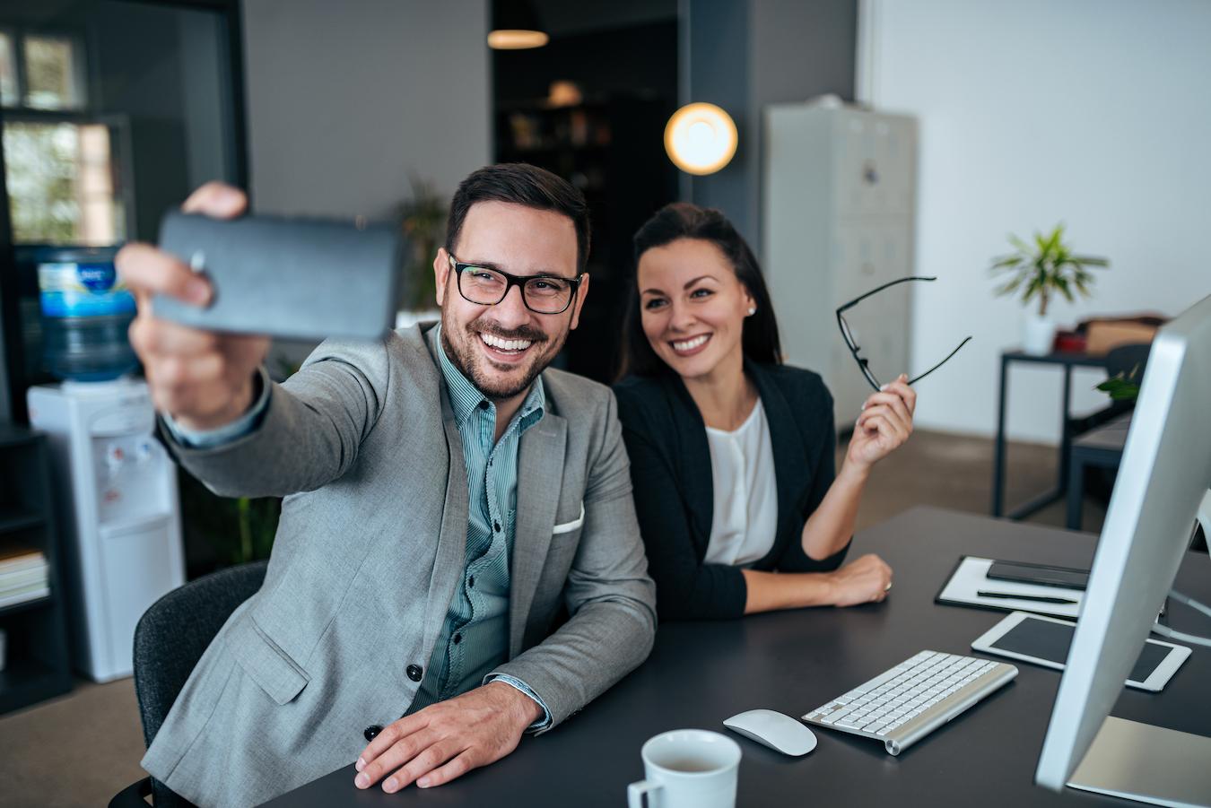 Two colleagues sit at a desk establishing rapport during which time they formed a mutual understanding and expressed empathy toward each other